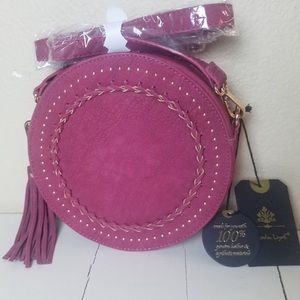 Wine colored round cross body purse